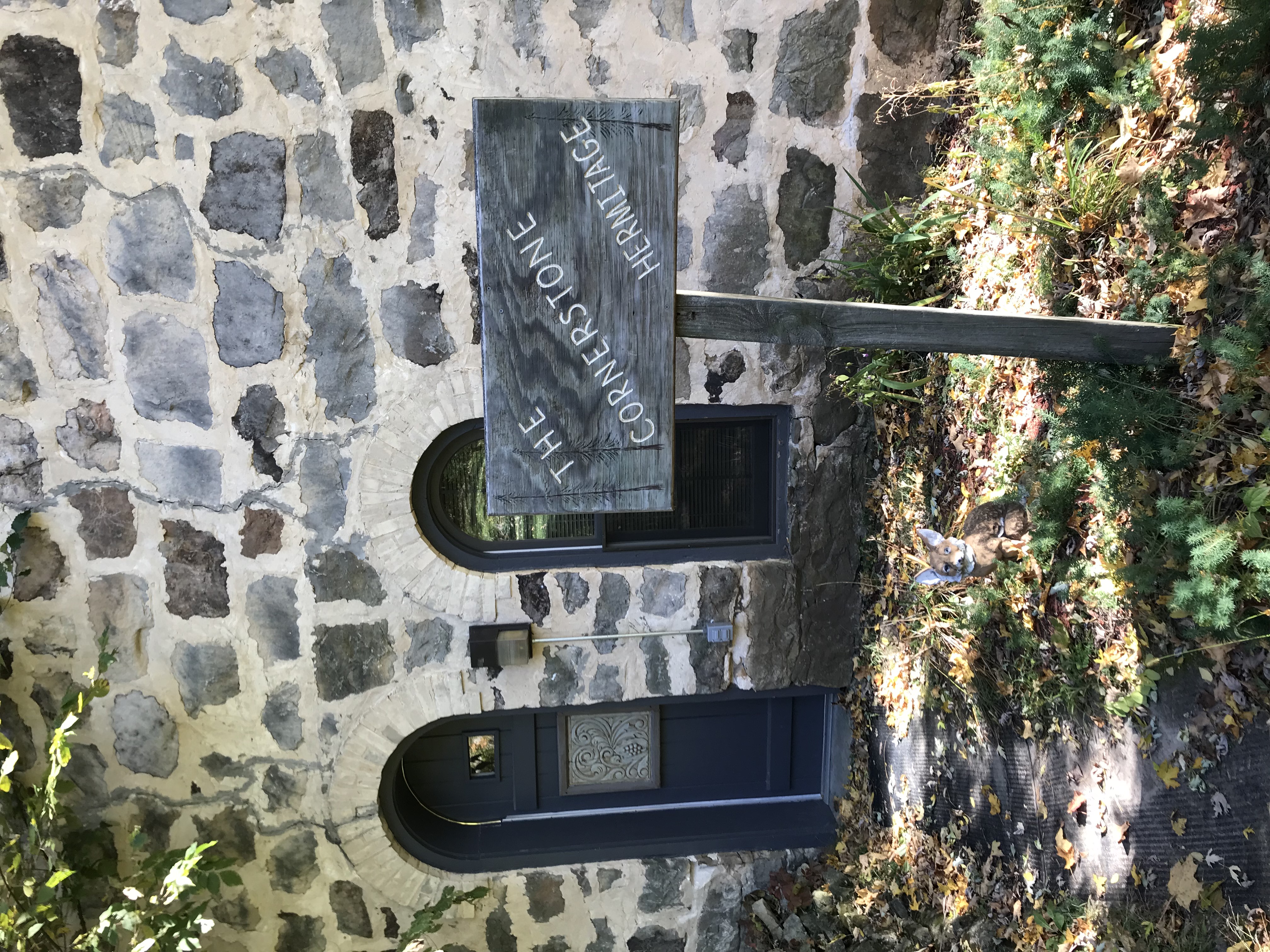 The Cornerstone Hermitage stone facade with arched windows and dark door